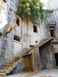 Low angle view of damaged building