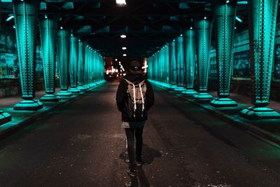 Man cycling on bridge