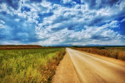 Scenic view of landscape against cloudy sky