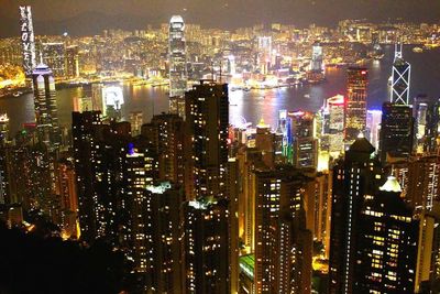 Aerial view of city lit up at night