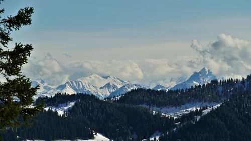 Panoramic view of snowcapped mountains against sky