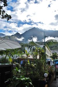 Mountain range against cloudy sky