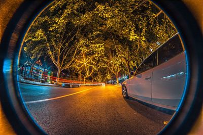 View of street seen through car windshield