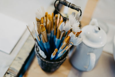 High angle view of paintbrushes on table at home