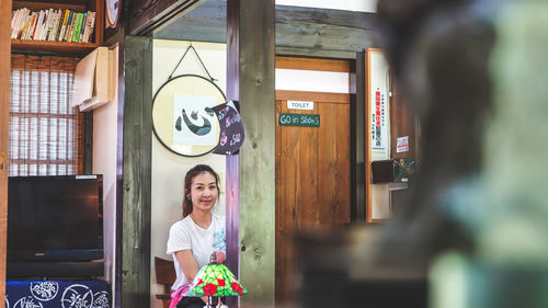 Portrait of smiling young woman looking away