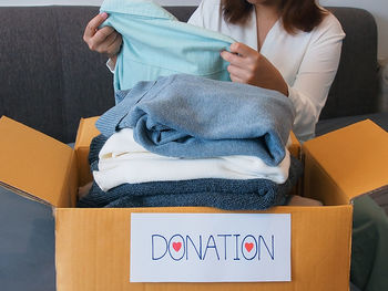 Midsection of woman holding gift box