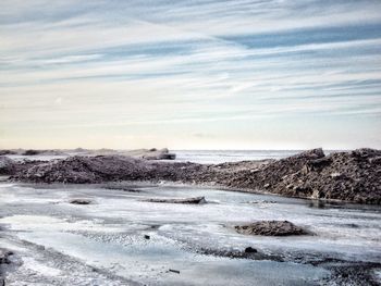 Scenic view of beach against sky