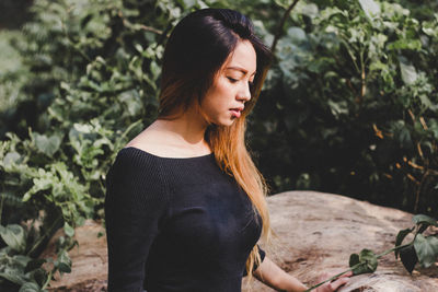 Close-up of woman standing in pond