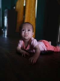 Portrait of cute baby girl at home