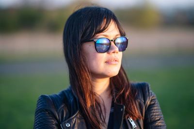 Portrait of a young woman wearing sunglasses