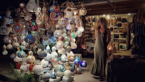 Woman standing at market stall