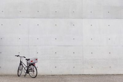 Bicycle parked against wall