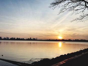 Scenic view of lake against sky during sunset