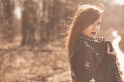 Portrait of woman standing outdoors