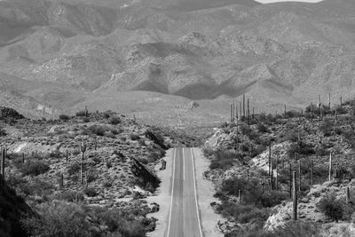 High angle view of road amidst trees and mountains