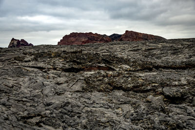 Rock formation on land against sky