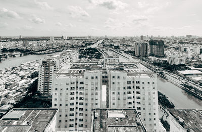 High angle view of buildings in city against sky