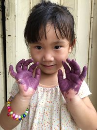 Portrait of cute girl standing outdoors