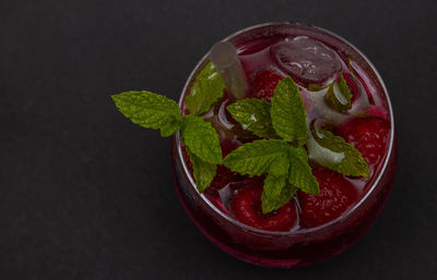 Close-up of strawberry over black background