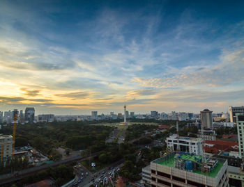 High angle view of city at sunset