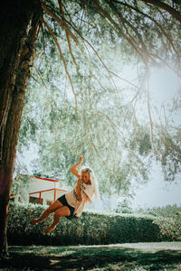 Woman playing on swing