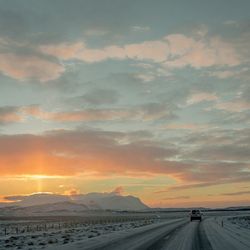 Scenic view of snow covered mountains against sky