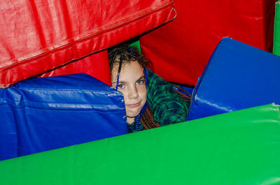 Portrait of woman sitting on sofa at home