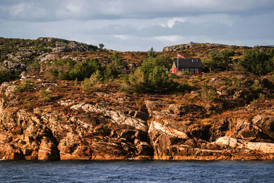 Scenic view of sea and buildings against sky