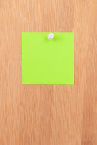 Close-up of green colored pencils on paper