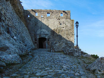 Low angle view of fort against blue sky