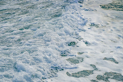 High angle view of flowing water in sea