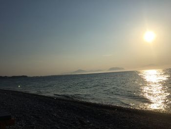 Scenic view of sea against clear sky during sunset