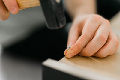 Cropped hands of person working on table