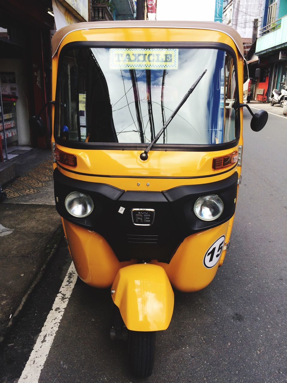 transportation, yellow, car, land vehicle, outdoors, mode of transport, city, public transportation, illuminated, yellow taxi, day, no people