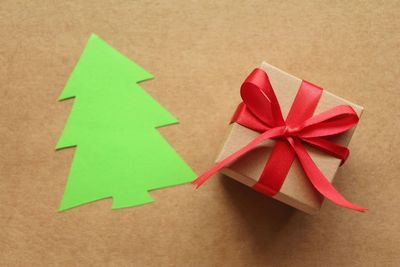 High angle view of christmas decorations on paper