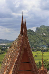 Panoramic view of temple and building against sky