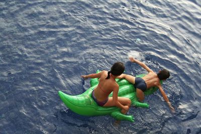 High angle view of men in sea