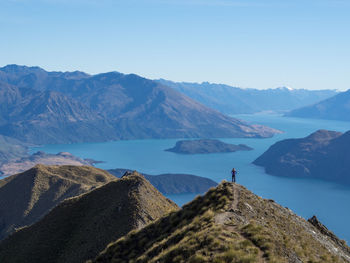 Scenic view of mountains against clear blue sky