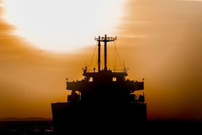 Silhouette of cranes at sunset