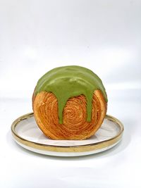 Close-up of dessert in plate on white background