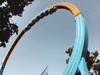 Low angle view of rollercoaster against sky