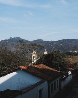 High angle view of trees and buildings against sky