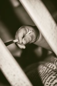 Close-up of baby hand pulling rope