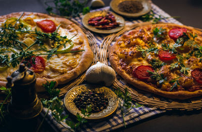 Close-up shot of pizzas served on table
