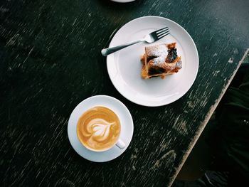 Close-up of cappuccino served on table