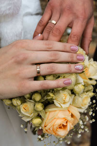 Close-up of hands holding bouquet of people