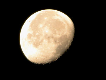 Low angle view of moon against sky at night