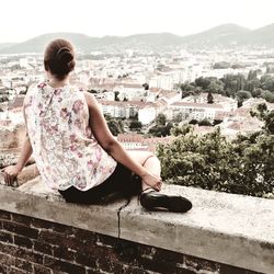 Woman looking at cityscape