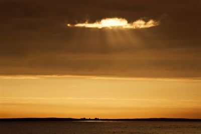 View of calm sea at sunset