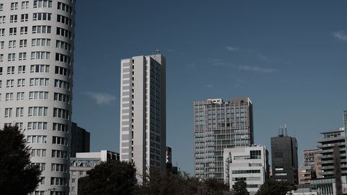 Skyscrapers in city against sky